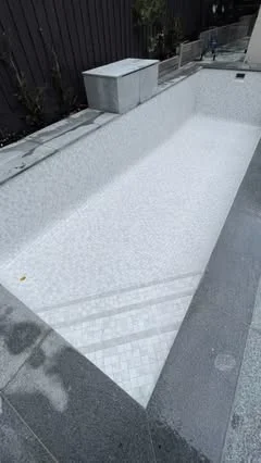 White mosaic pool tiling by Euro Pool Renovations