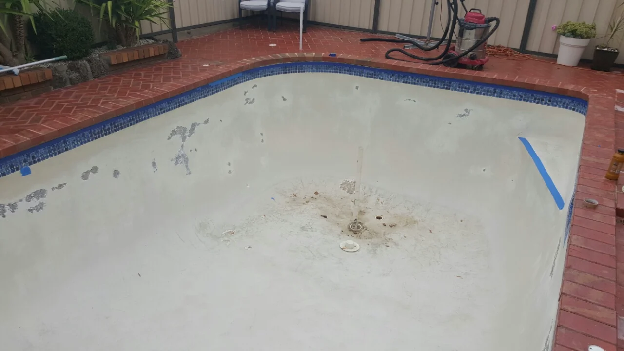 Pool surface stripped and prepped before painting